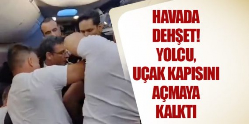 Uçuş sırasında uçağın kapısını açmaya çalışan yolcu, bantla bağlandı